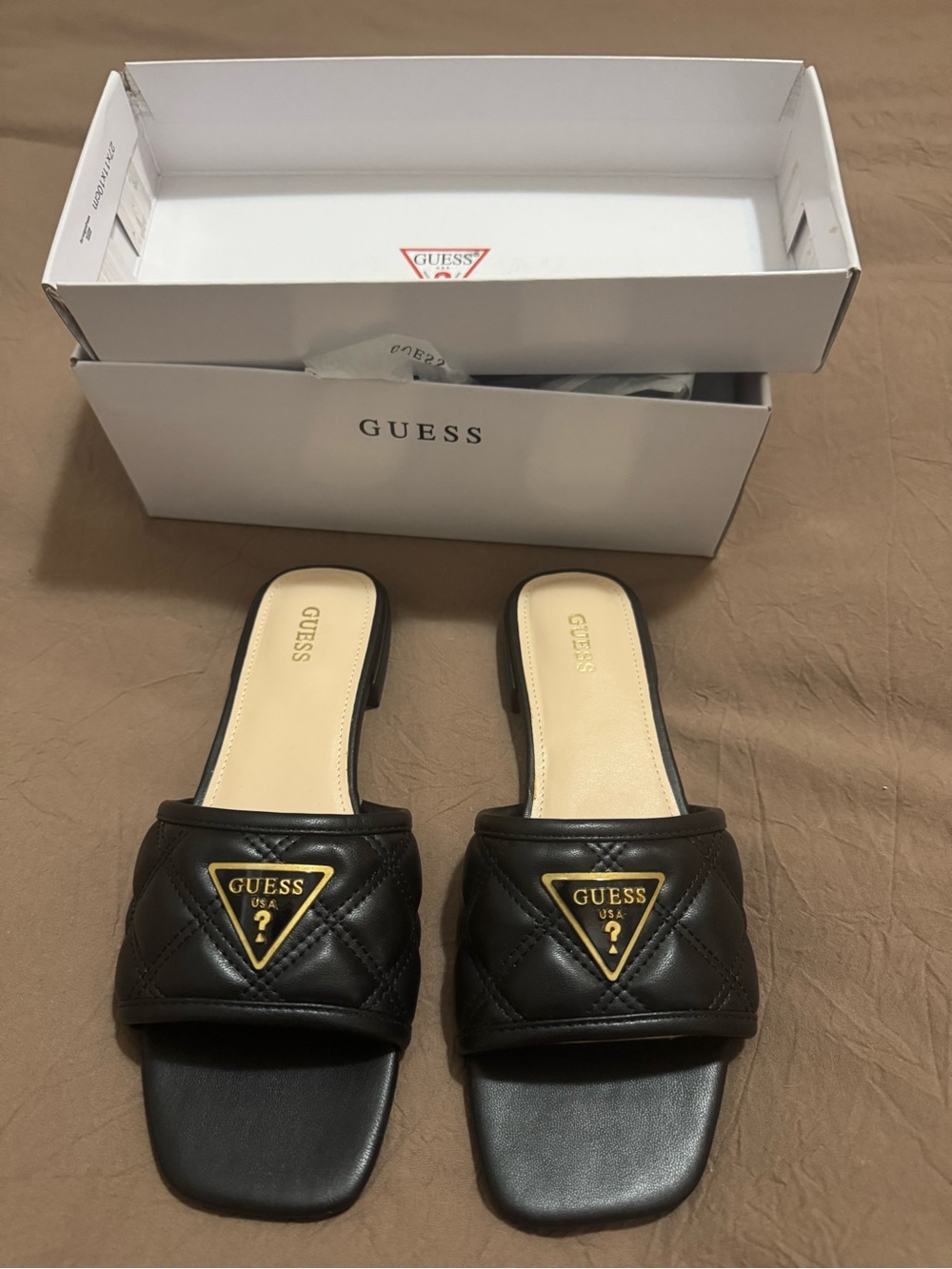 GUESS Black Quilted Slide Mules with Gold Emblem